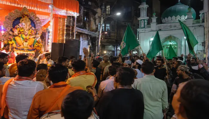 Hindu Ganpati pandal targeted in Mumbai: Two Muslim men wave Islamic flags after dispute over devotional songs played near mosque
